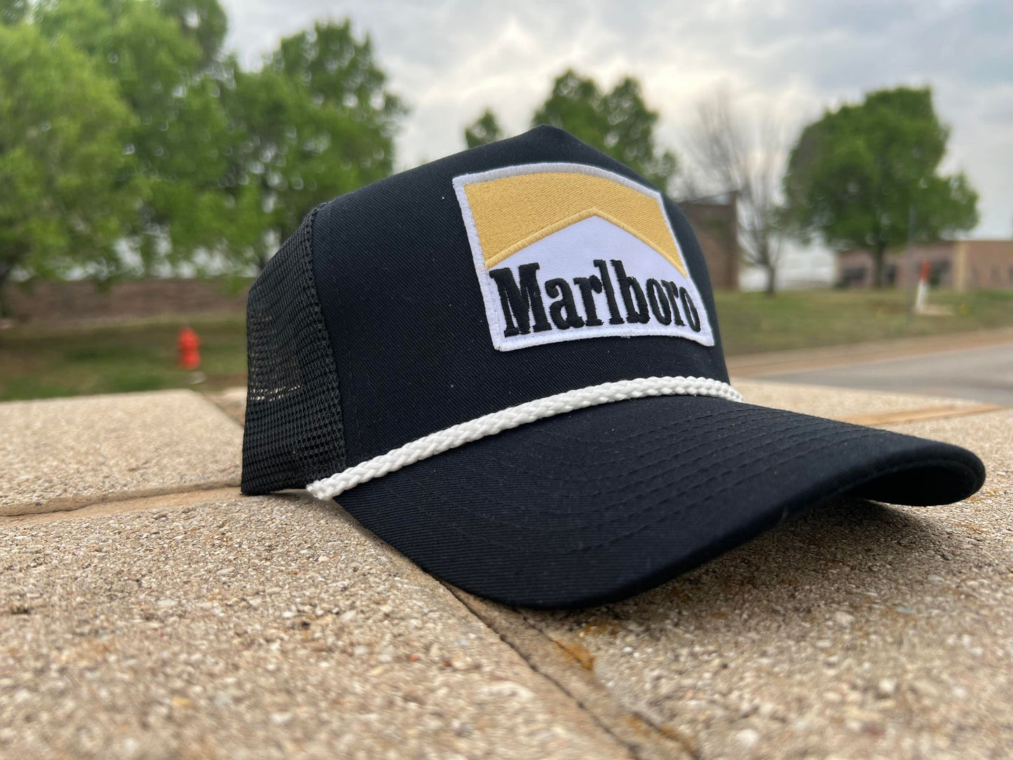 a black hat with a marlboro patch on it