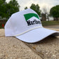 a marlboro hat sitting on the side of a road